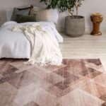 Cozy bedroom with geometric rug and plants