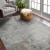 Modern living room with gray rug and armchair.