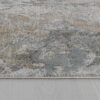 Abstract textured carpet on wooden floor