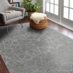 Modern living room with patterned gray carpet.
