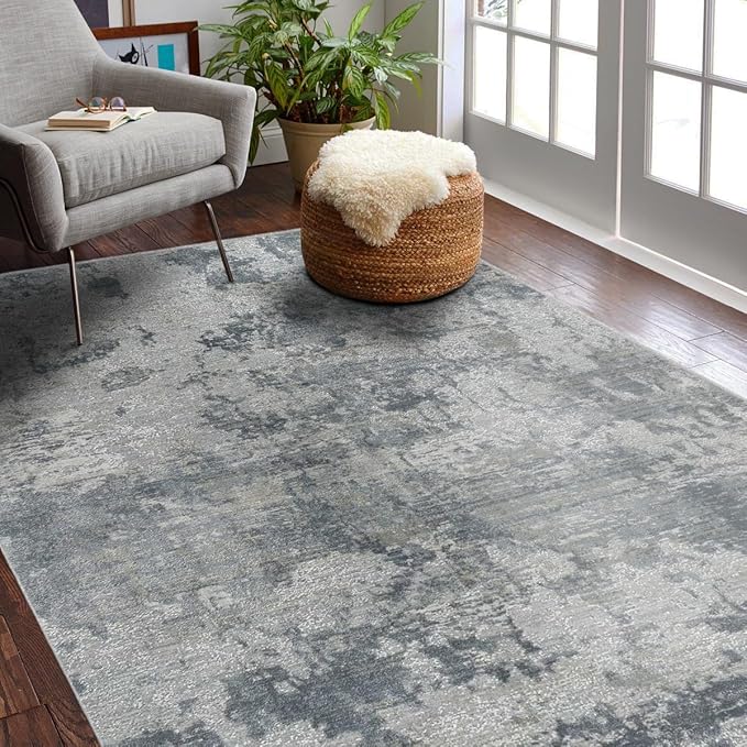 Cozy living room with gray patterned rug and chair.