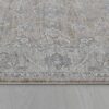 Gray patterned rug on wooden floor