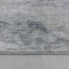 Gray abstract area rug on hardwood floor