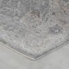 Gray patterned rug on wooden floor