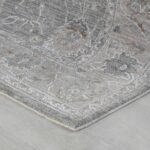 Gray patterned rug on wooden floor