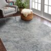 Modern living room with gray patterned rug.