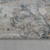 Textured gray rug on wooden floor.