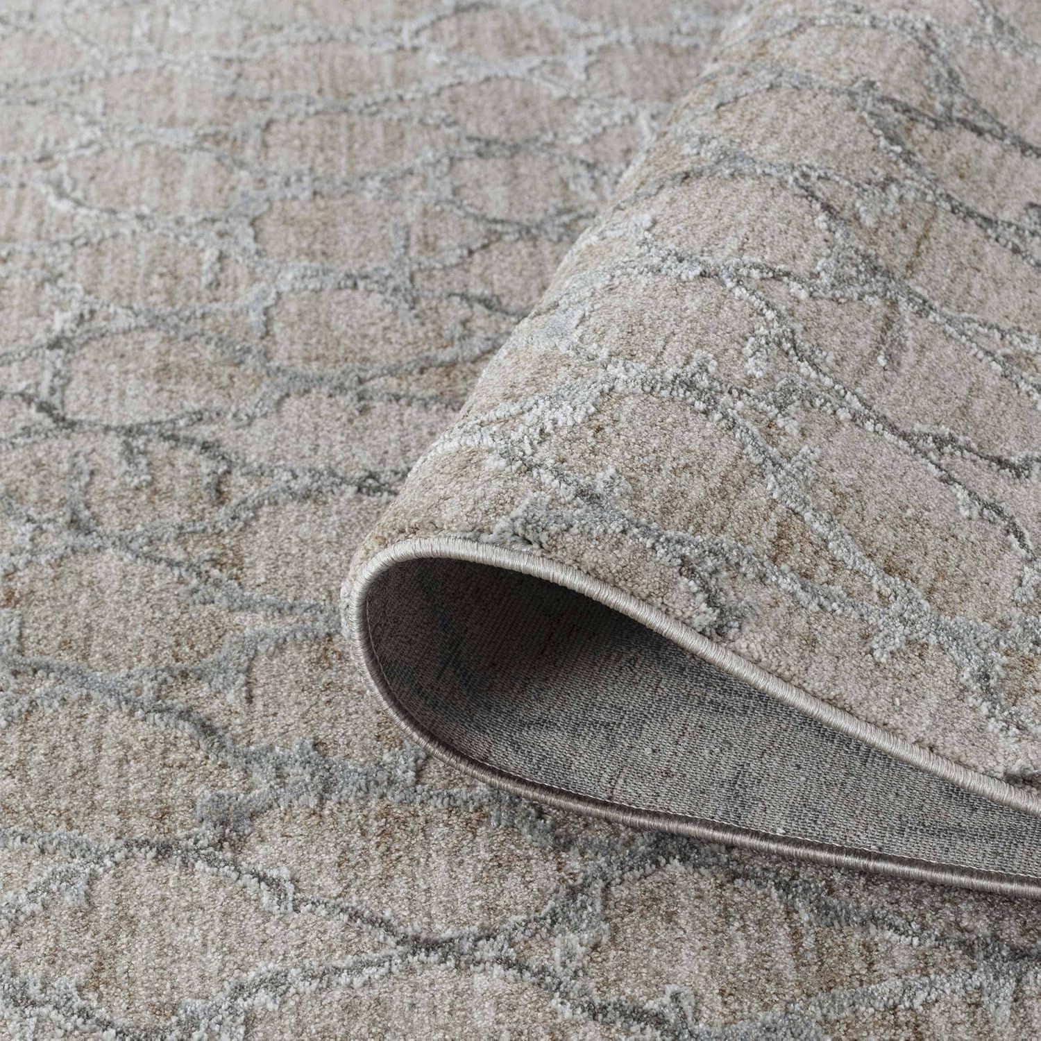 Close-up of rolled gray patterned carpet