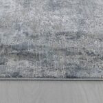 Abstract gray and blue textured area rug.
