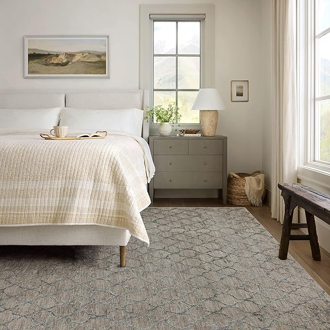 Cozy modern bedroom with neutral decor.