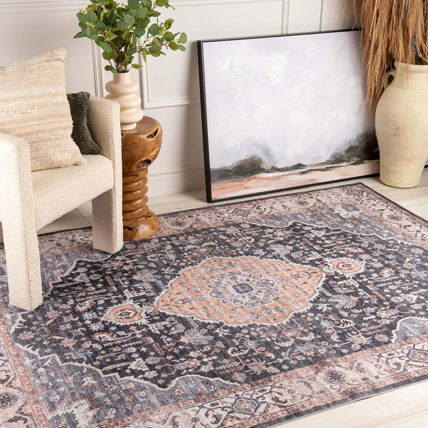 Cozy room with decorative rug and painting.