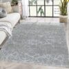 Modern living room with abstract carpet design.
