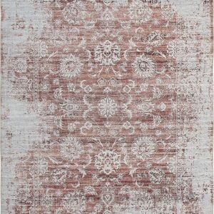 Vintage floral patterned rug, distressed, brown and beige.