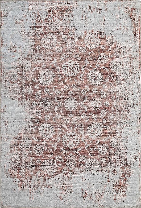 Vintage floral patterned rug, distressed, brown and beige.