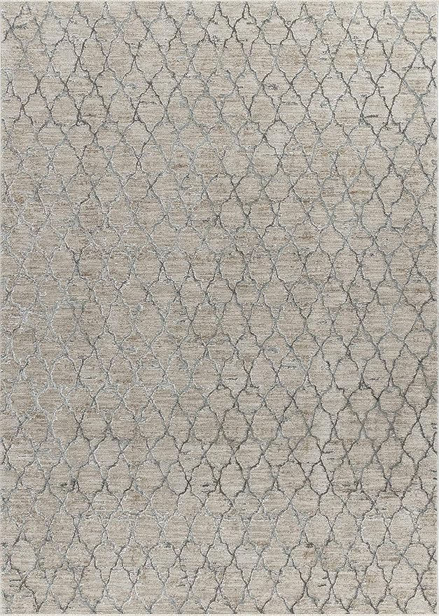 Beige rug with intricate geometric pattern.