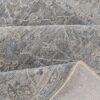 Gray textured rug with intricate patterns