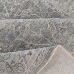 Gray textured rug with intricate patterns