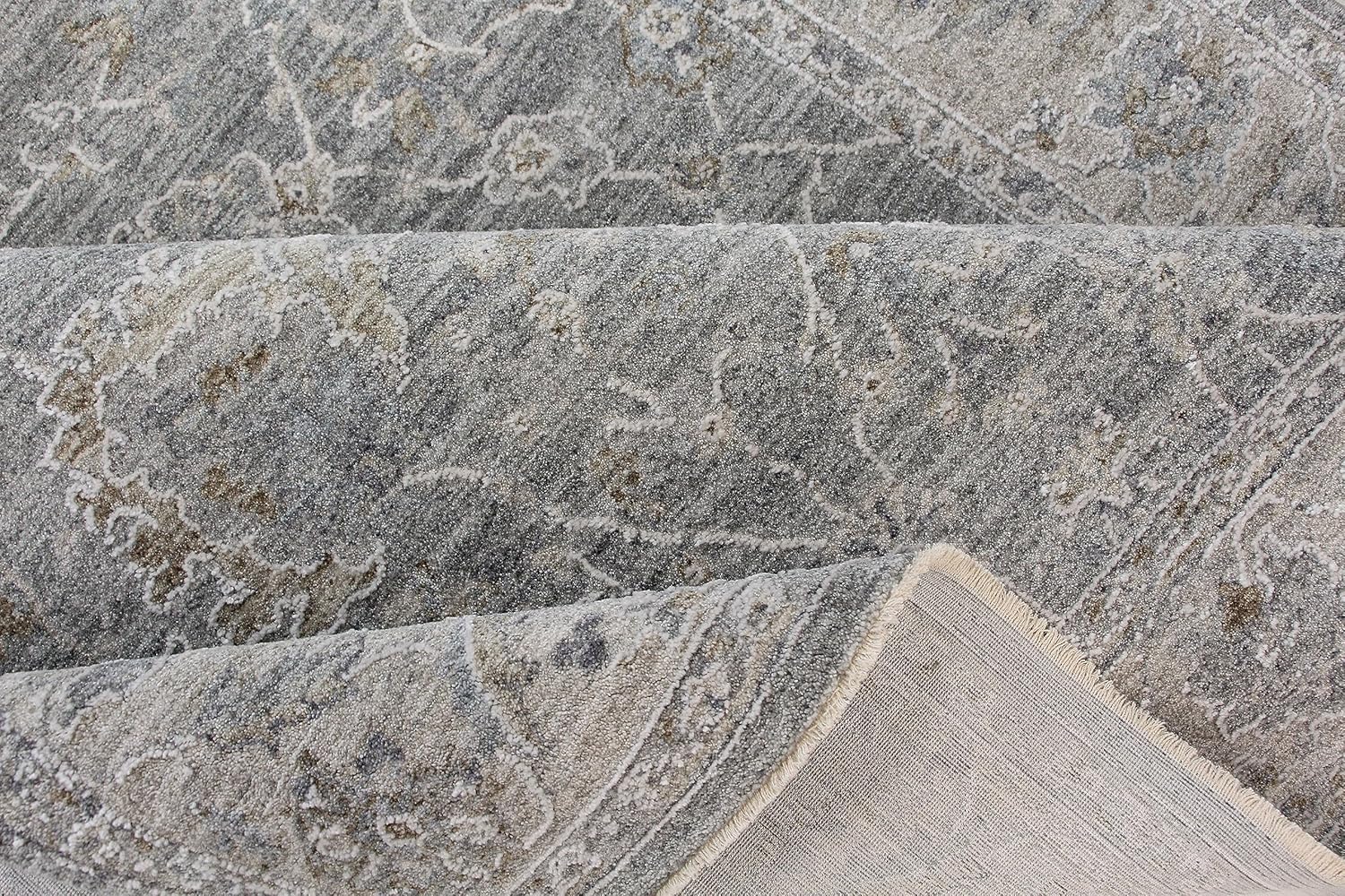 Gray textured rug with intricate patterns