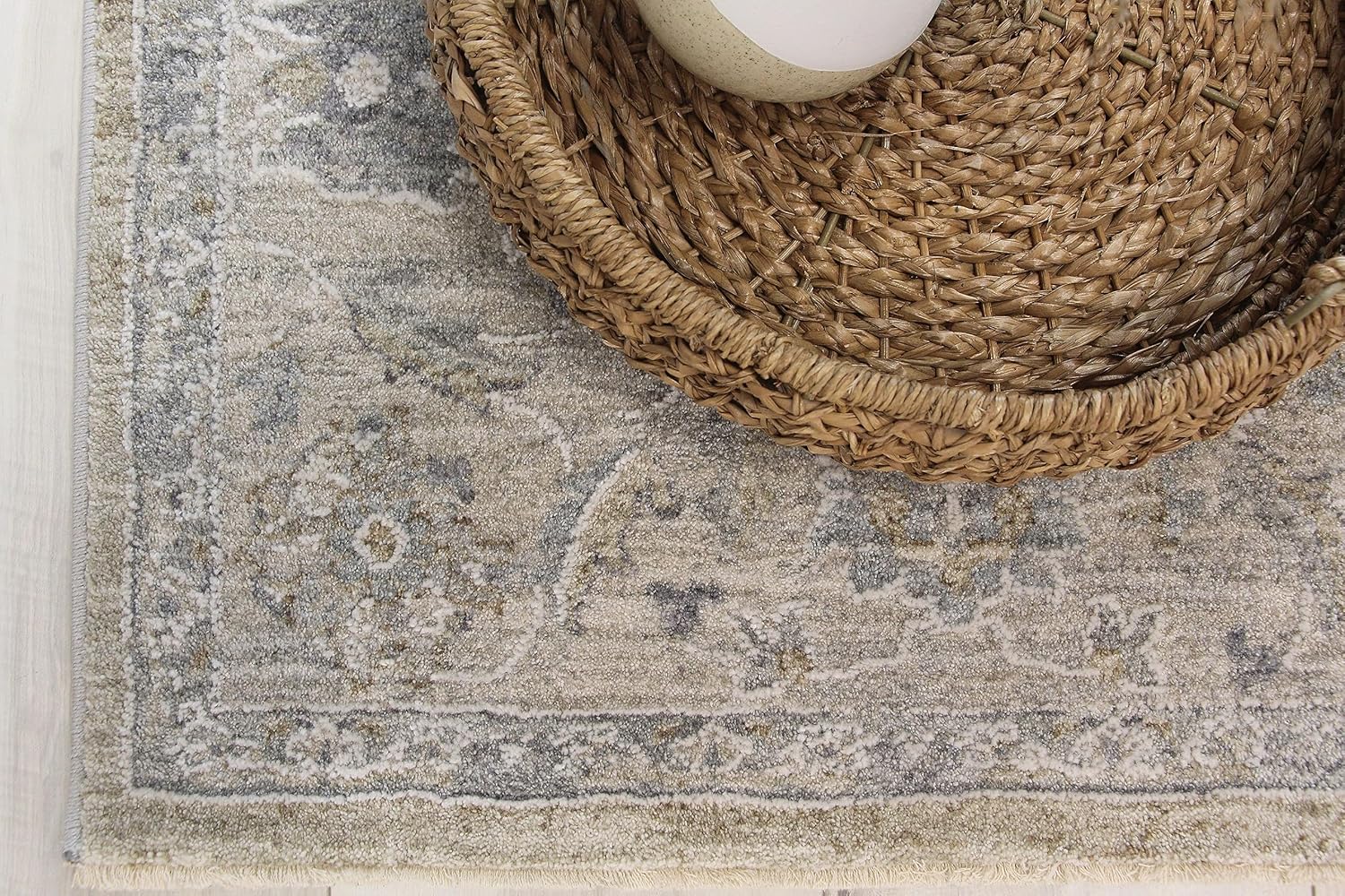 Woven basket on decorative area rug