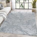 Living room with gray textured rug.