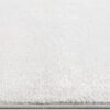 Close-up of white textured carpet surface