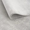 Folded light gray textured carpet