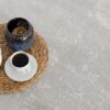Tea set and candle on woven mat