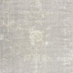 Beige vintage-style area rug with subtle floral pattern.