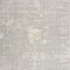 Beige vintage-style area rug with subtle floral pattern.