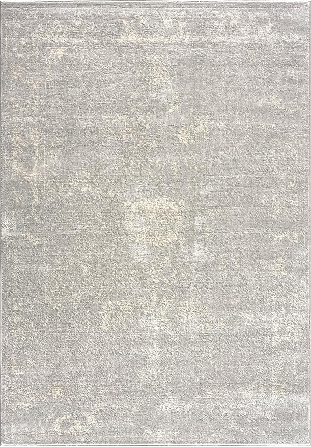 Beige vintage-style area rug with subtle floral pattern.