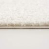 Close-up of fluffy white carpet edge