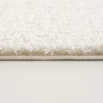 Close-up of fluffy white carpet edge