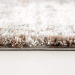 Close-up of fluffy beige shag carpet