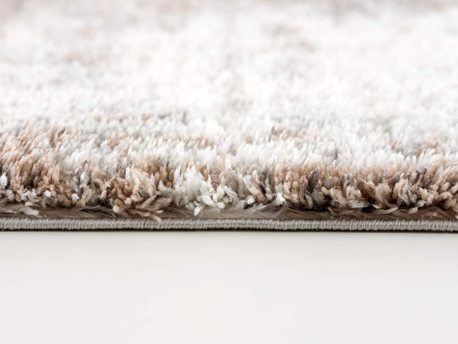 Close-up of fluffy beige shag carpet