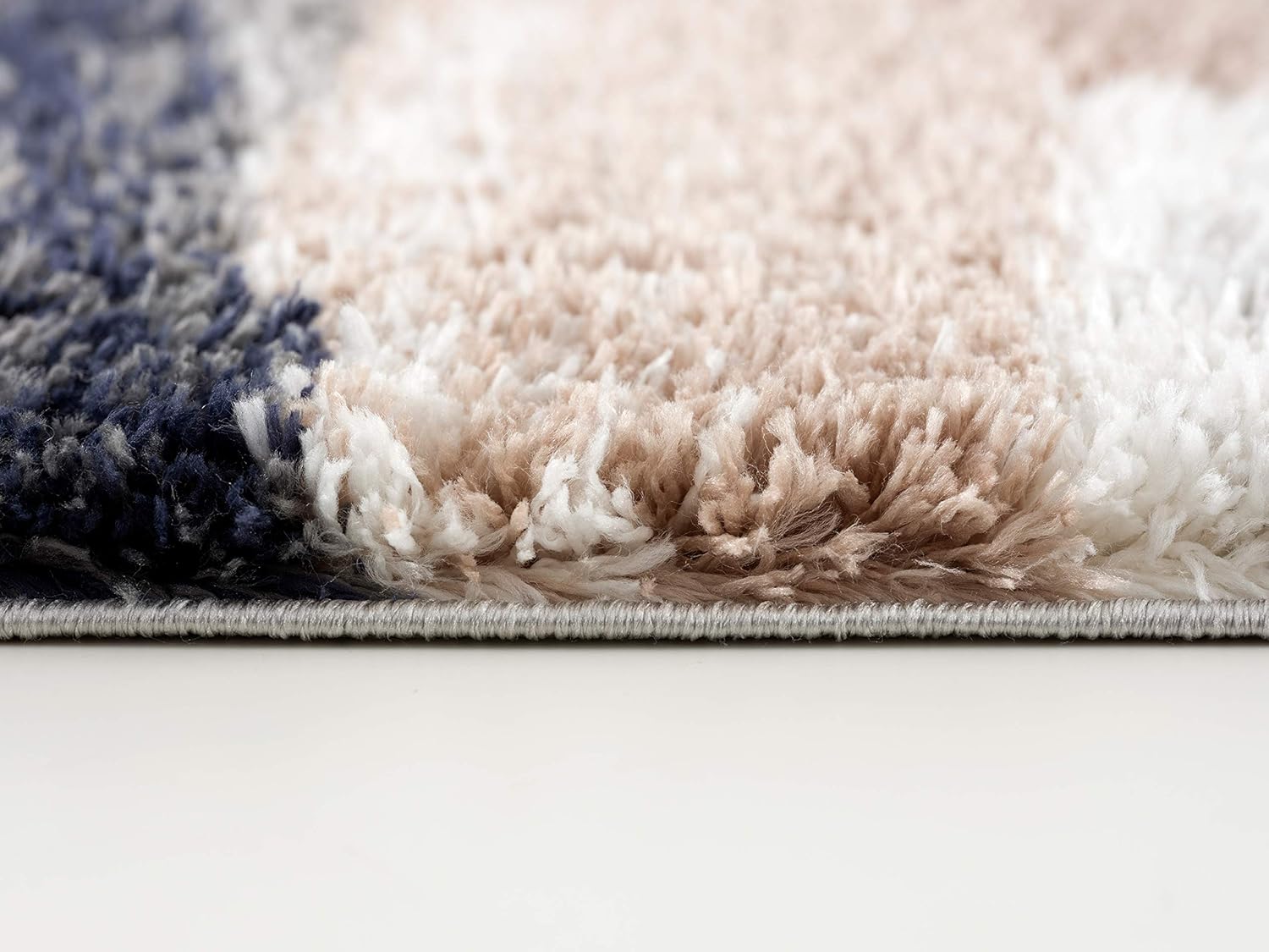 Close-up of plush multicolored shag rug texture