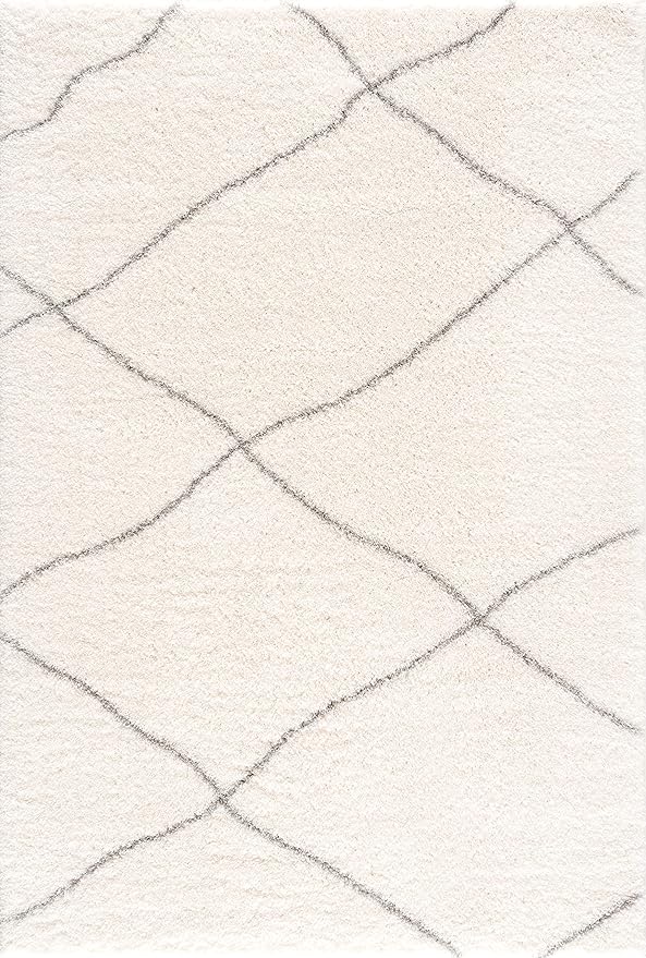 White rug with simple geometric lines.
