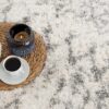 Cozy rug with coffee, teapot, and candle