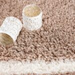 Patterned cups on fluffy beige carpet