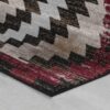 Geometric patterned rug with red, black, beige colors