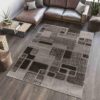 Modern living room with geometric patterned rug.