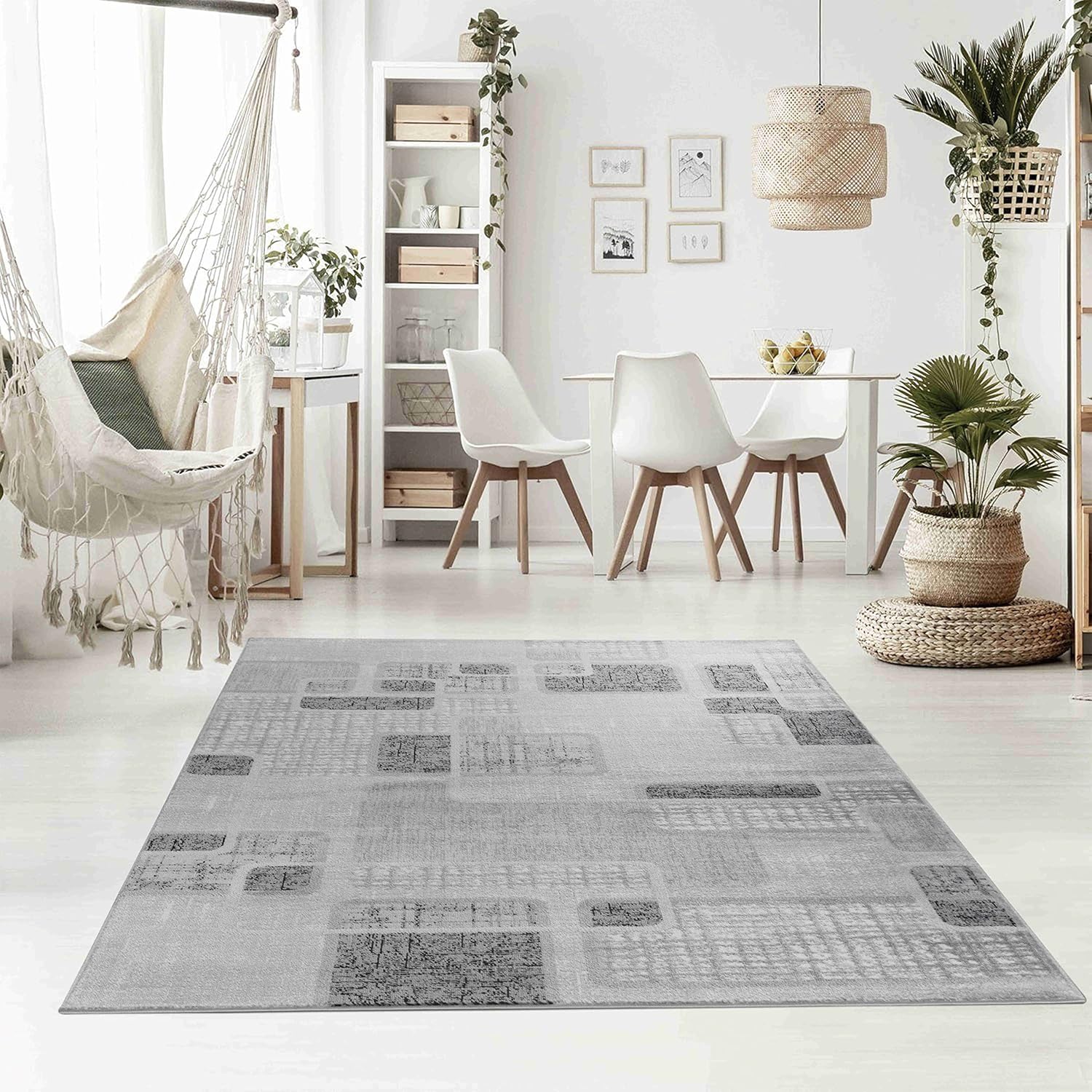 Modern cozy living room with rug and plants.