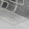 Gray abstract rug on wooden floor