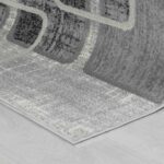 Gray abstract rug on wooden floor