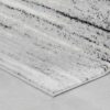 Gray and white rug on wooden floor