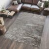 Modern living room with large patterned rug.