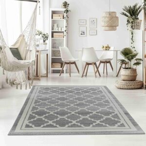 Modern living room with gray patterned rug.