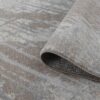Close-up of gray textured rug corner