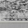 Close-up view of a patterned gray carpet.