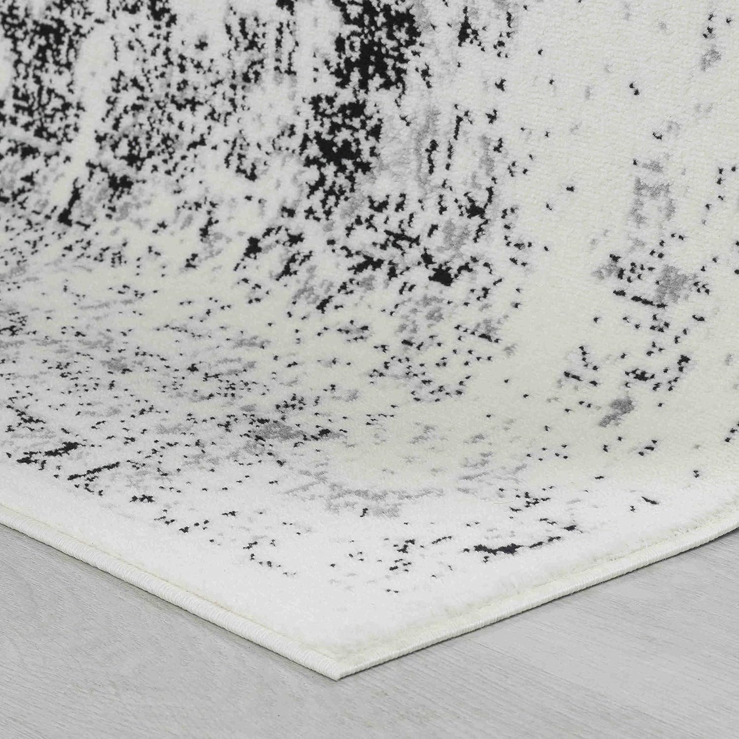 Black and white textured rug on floor