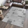 Modern living room with geometric patterned rug.
